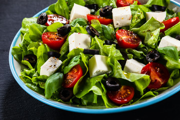 Greek salad on stone background