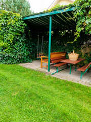 Garden with shed and picnic table.