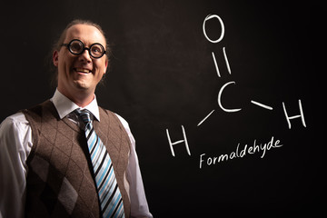 Professor presenting handdrawn chemical formula of Formaldehyde