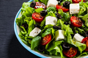 Greek salad on stone background