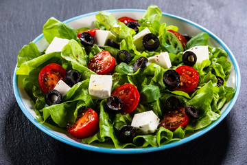 Greek salad on stone background