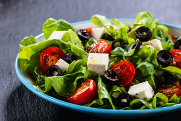 Greek salad on stone background