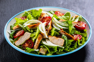 Caesar salad on stone table