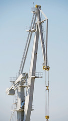 old port crane on background sky