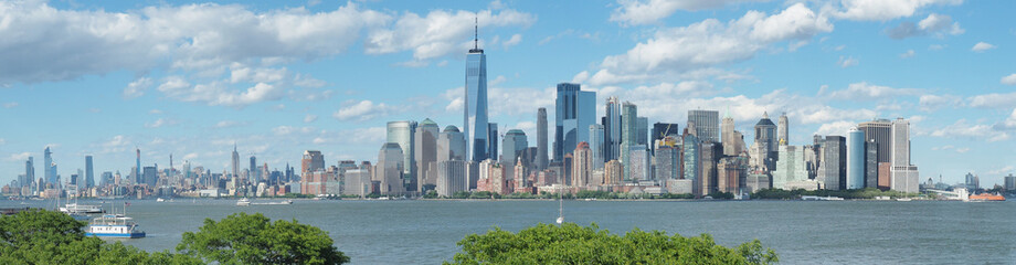 New York, NY, USA. Amazing skyline of Manhattan skyscrapers and buildings from Ellis Island....