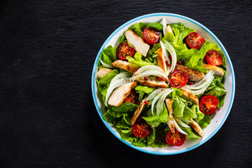 Caesar salad on stone table