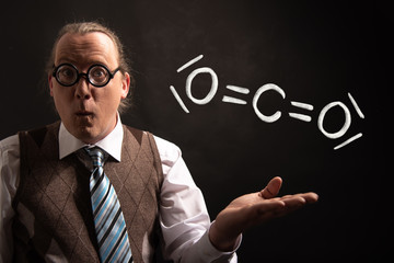 Professor presenting handdrawn chemical formula of co2