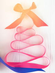 Christmas tree satin pink ribbon, on white background, copy space, holiday, Christmas, next Christmas gift
