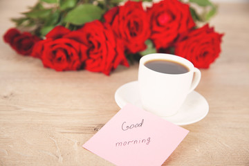 good morning text on card with coffee and roses