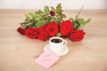 Fototapeta na wymiar good morning text on card with coffee and roses