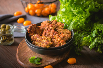 Homemade chicken cutlets on rustic background