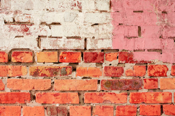 Texture of a brick wall with cracks and scratches which can be used as a background