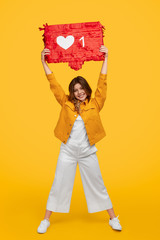 Smiling lady with like banner