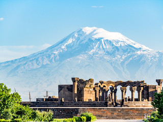 Ancient ruins of Zvartnots Cathedral in Armenia and the Mount Ararat