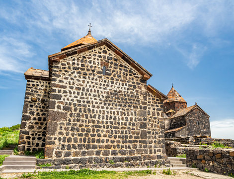 Ancient walls and domes of two churches of Sevanavank monastery complex, located on a peninsula at the shore of Lake Sevan in Armenia, not far from the town of Sevan.