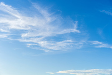 Naklejka na ściany i meble Blue sky and white puffy clouds