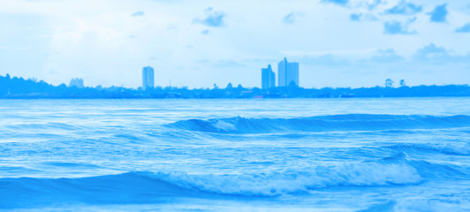 A tranquil blue sea and resort town after stormy.