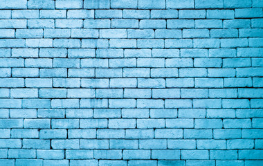 Fototapeta na wymiar Blue rough brick wall grunge texture pattern for background in rural room. Abstract weathered cyan stonewall wallpaper for business card design. Light blocks of stonework for your blank text.