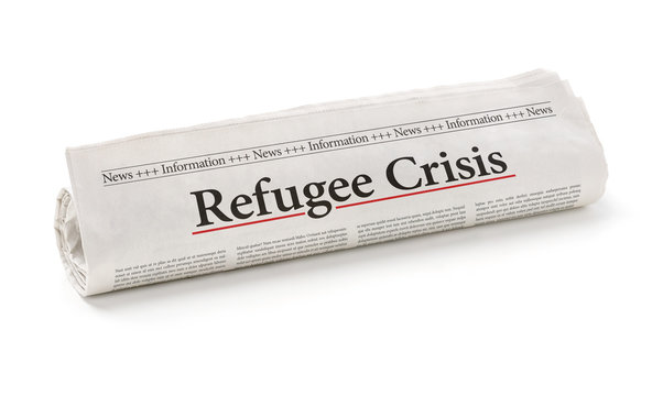 Rolled newspaper with the headline Refugee Crisis