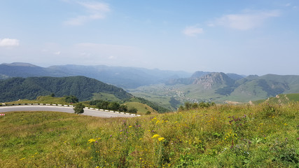 Gumbashi pass view in the russian caucasus, green meadow landscape at an altitude of above 2000 m