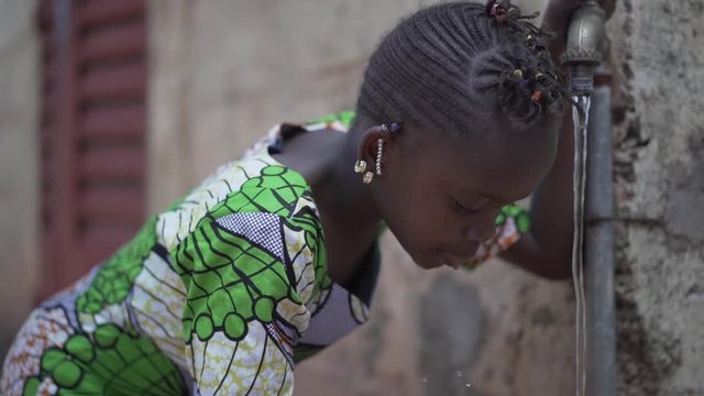 Health and Hygiene symbol, Black Young Girl Drinking Fresh Clean Water from Tap