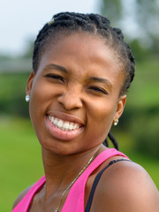 Pretty young African woman with a friendly smile