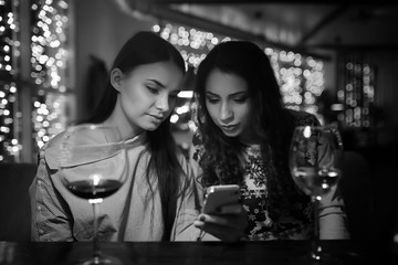 The girl in the evening in a cafe