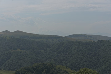 Gumbashi pass view in the russian caucasus, green meadow landscape at an altitude of above 2000 m