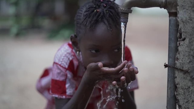Close up Slow Motion of African Black Girl Drinking Safe Water from Tap