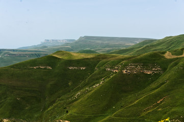 Gumbashi pass view in the russian caucasus, green meadow landscape at an altitude of above 2000 m