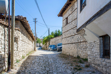 Fototapeta na wymiar street in old town stone courtyard in Berat Fortress, Albania, Balkans