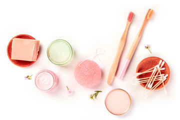 Plastic-free, zero waste products, flat lay on a white background with copyspace. Bamboo toothbrushes and cotton swabs, konjac sponge, natural and organic