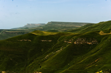 Gumbashi pass view in the russian caucasus, green meadow landscape at an altitude of above 2000 m