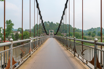 Obraz premium Iron rope suspension bridge in the ancient town of Huanglongxi, Chengdu, Sichuan Province, China