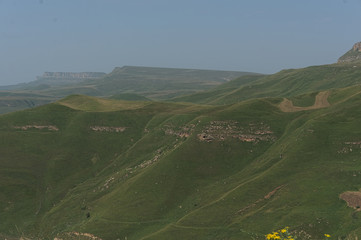 Gumbashi pass view in the russian caucasus, green meadow landscape at an altitude of above 2000 m