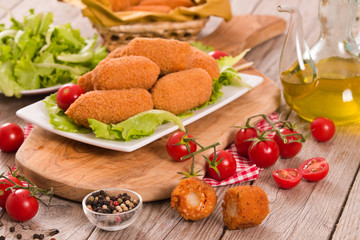 Supplì, italian fried rice balls.