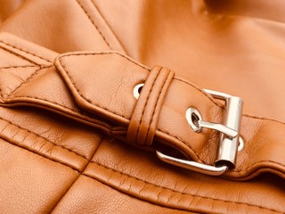 Buckle on a fake leather jacket