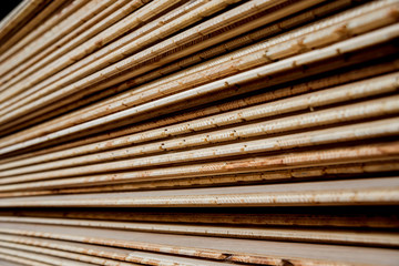 Stack of natural rough wooden boards. Wooden boards, lumber, industrial wood.