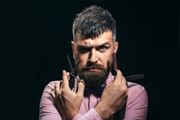 Professional barber. Male stylist. Scissors and razor. Young hairdresser.