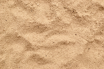 Seamless background of beige sand