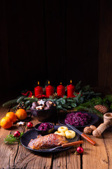 Roast goose with baked apples, red cabbage and dumplings