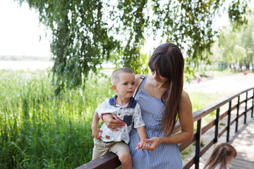 Mother and childs in park. Concept of summer,childhood and leisure