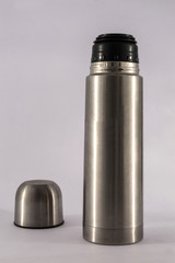 Stainless steel vacuum flask isolated on the white background