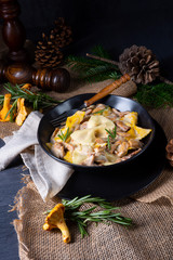 Colorful farfalle pasta with chanterelles and cream sauce.