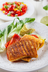 Grilled hallumi cheese with tomato salad and fresh onion