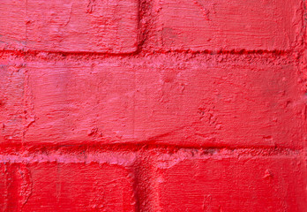RED brick  cement wall with peeling plaster horizontal background texture wallpaper close up