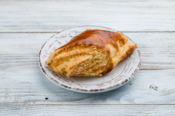 Oriental dessert Gata on light wooden table