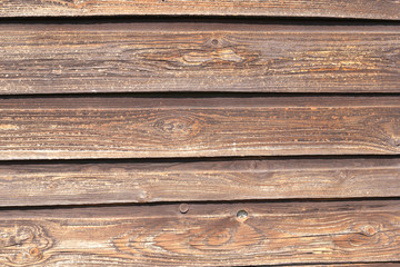 Obraz premium fragment of an old wooden wall from unpainted horizontal boards