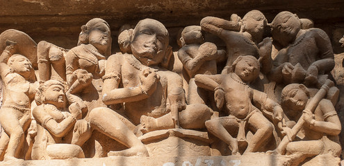 Sculptures on the walls of famous Khajuraho Temples in India. Khajuraho Temples are one of the...