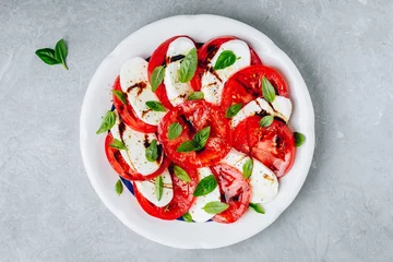 Foto op Plexiglas Tomato, basil, mozzarella Caprese salad with balsamic vinegar and olive oil. © nblxer